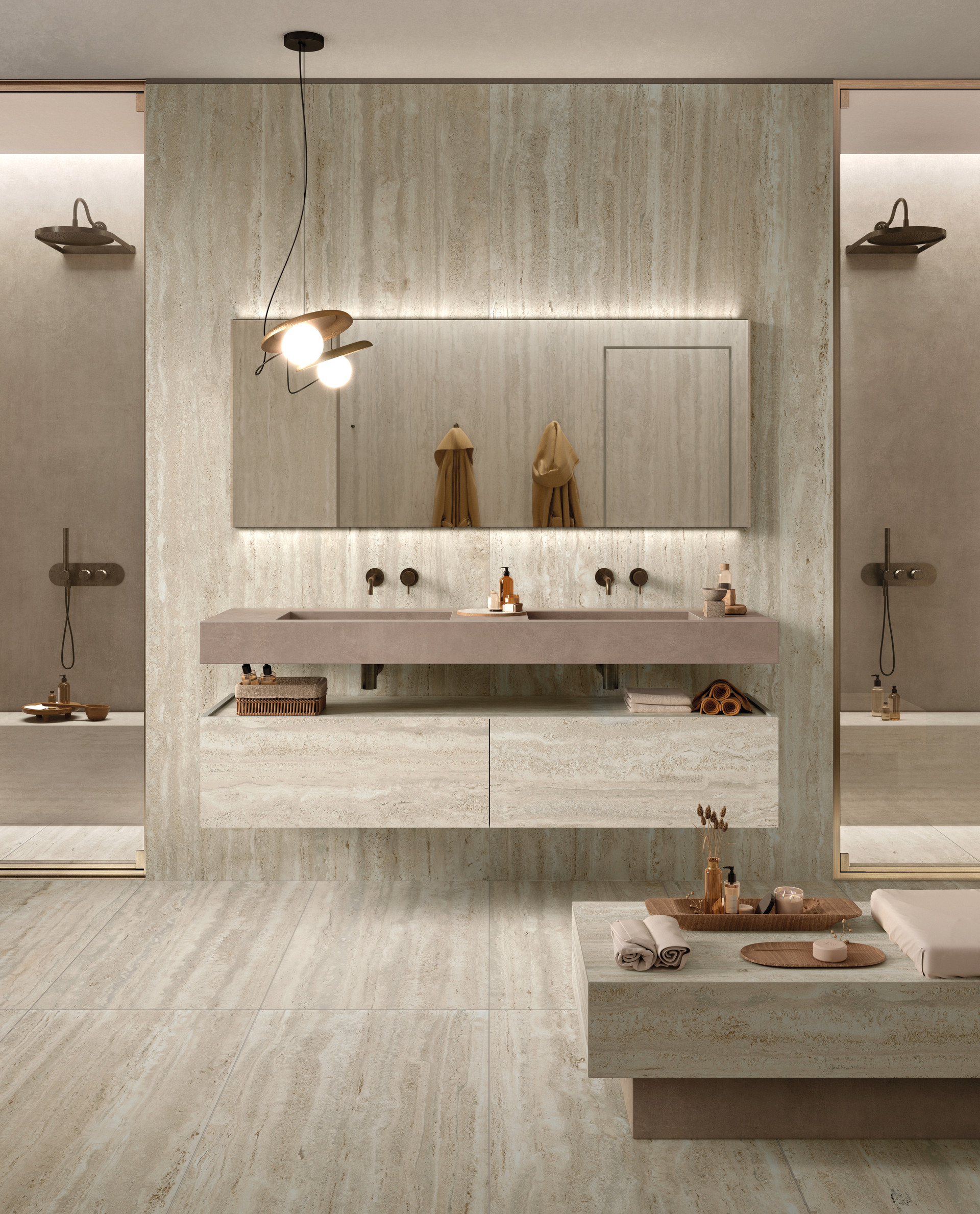 Badezimmer EY07 Blick auf Badezimmer mit Waschbecken zentral und Duschen links und rechts